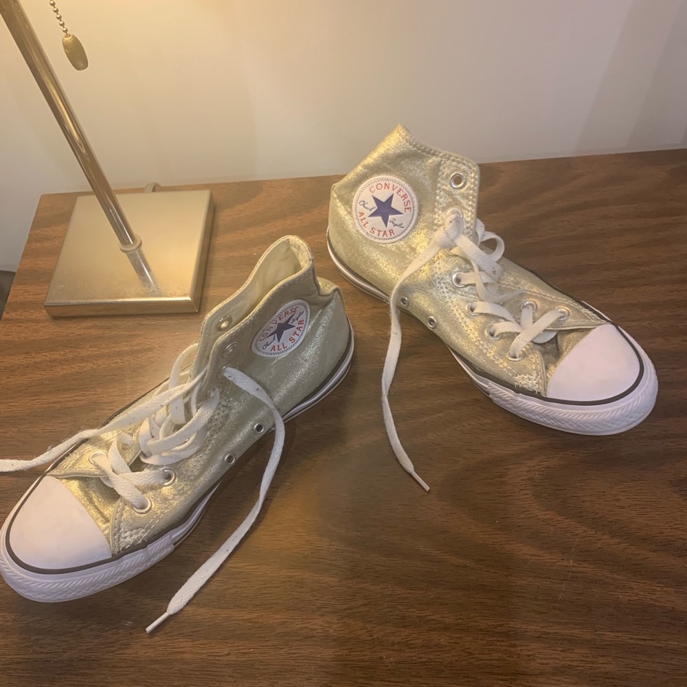 Metallic gold Converse Chuck Taylors.